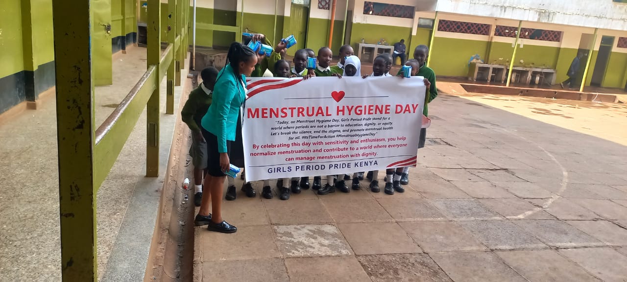 Students holding Menstrual Hygiene Day banner from Girls Period Pride Kenya